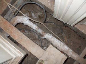 Asbestos lagging around old heating pipes