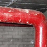 Painted asbestos lagging around a pipe